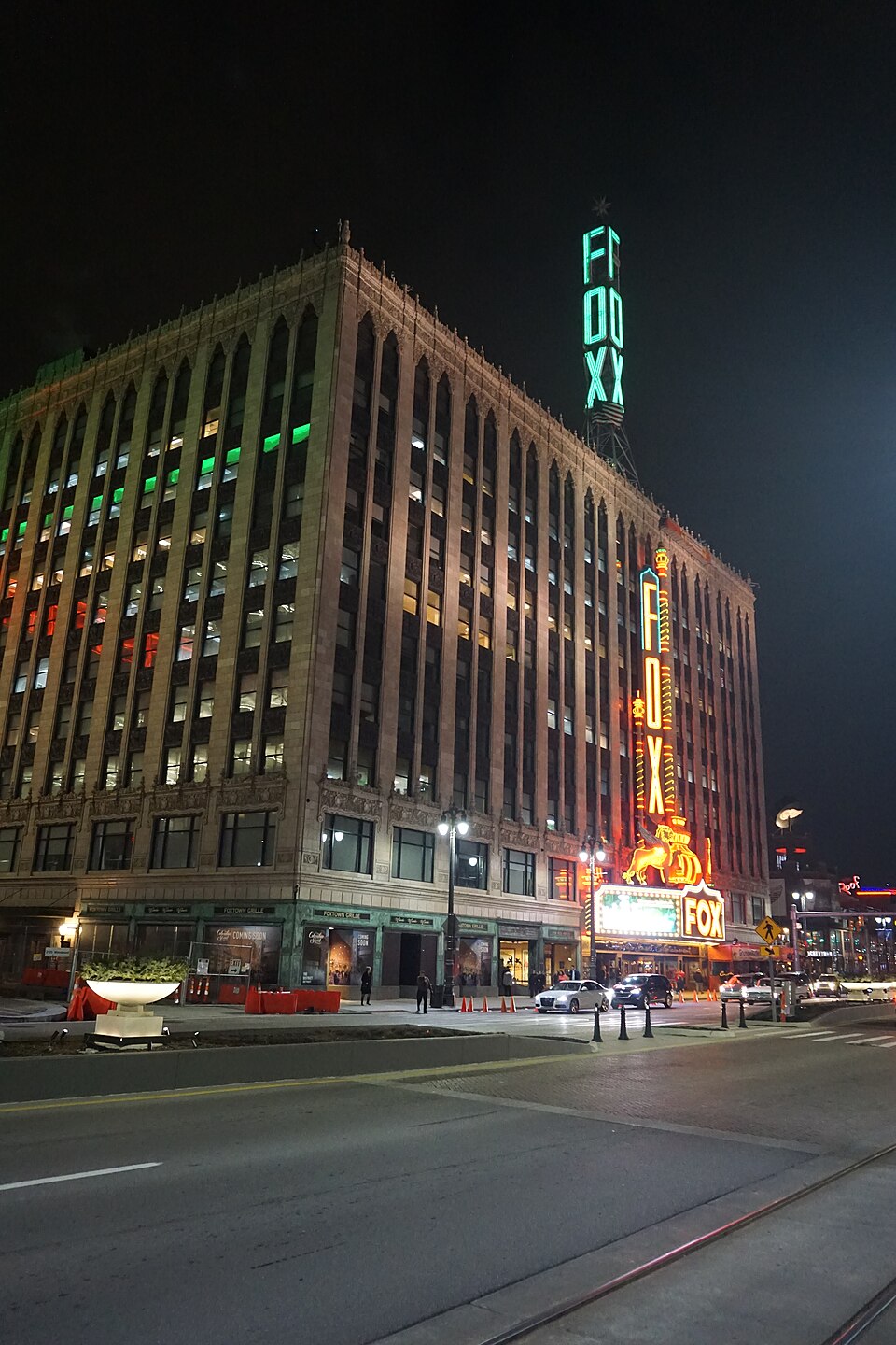 An ornate theater with a lit marquee
