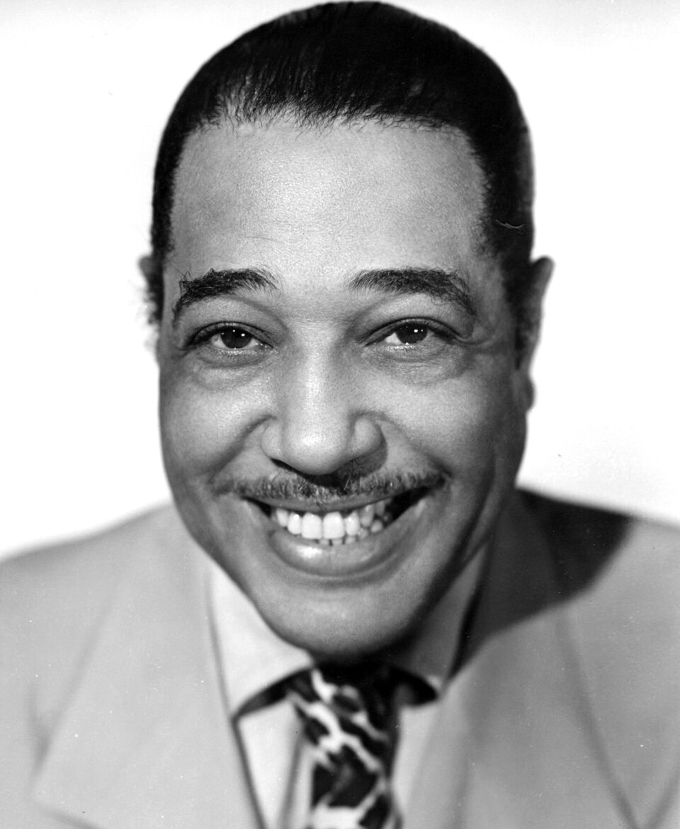 Duke Ellington seated at a piano