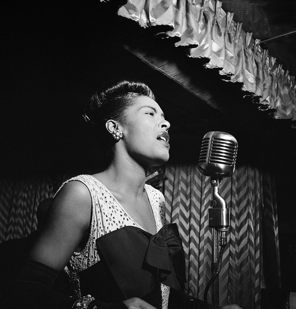 Billie Holiday singing, gardenia in her hair