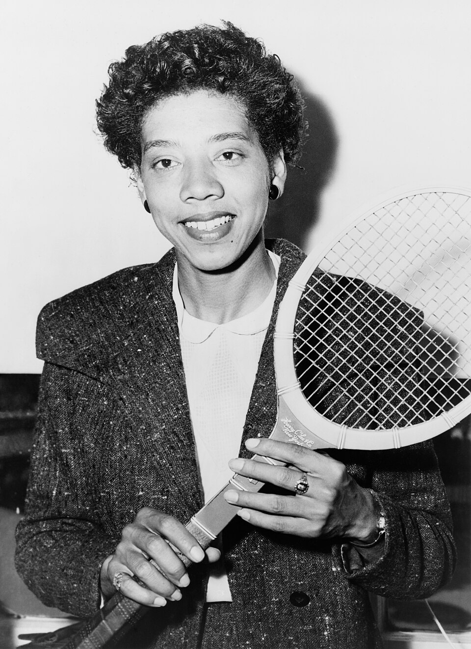 Althea Gibson holding a tennis racket